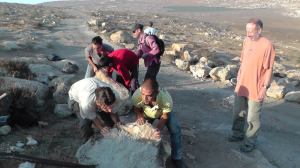 Activists repairing the road in Bir al-'Id. Photo: Guy